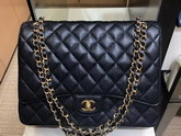 Chanel Maxi Classic Handbag Black Grained Calfskin and Gold Tone Metal A58601