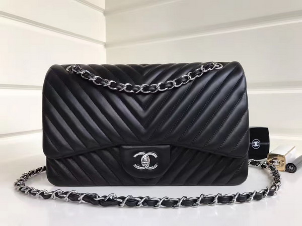 Chanel Maxi Flap Bag in Black Chevron Lambskin Silver Metal For Sale