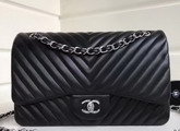 Chanel Maxi Flap Bag in Black Chevron Lambskin Silver Metal For Sale