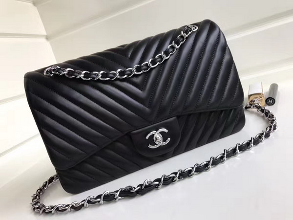 Chanel Maxi Flap Bag in Black Chevron Lambskin Silver Metal For Sale