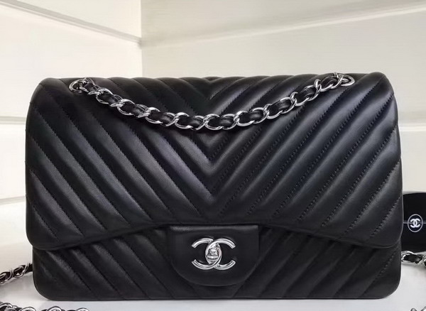 Chanel Maxi Flap Bag in Black Chevron Lambskin Silver Metal For Sale