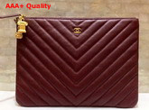 Chanel Pouch in Burgundy Grained Lambskin with Charms Replica