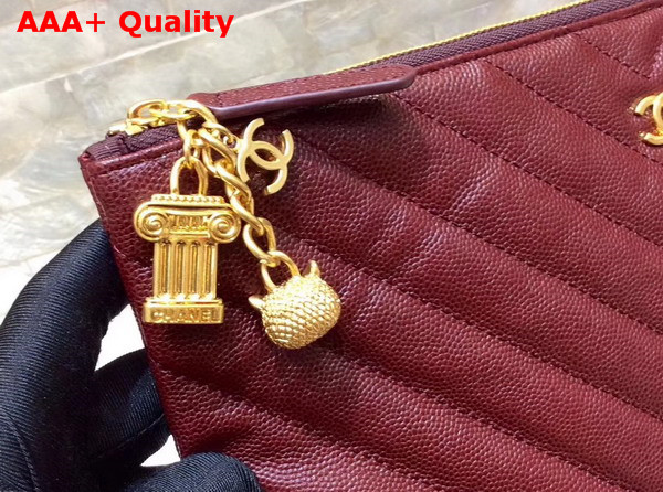 Chanel Pouch in Burgundy Grained Lambskin with Charms Replica