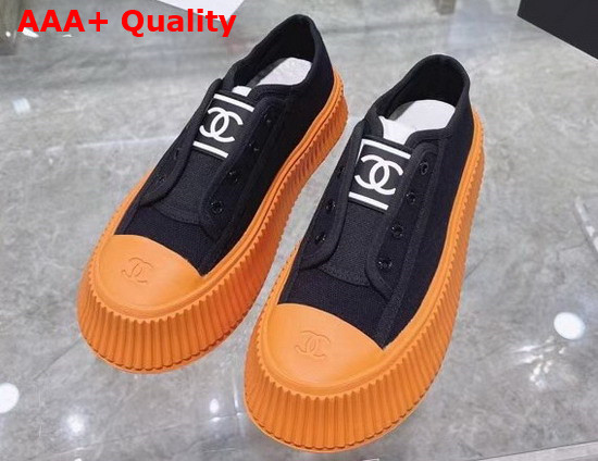 Chanel Sneaker in Black Canvas with Orange Rubber Sole Replica