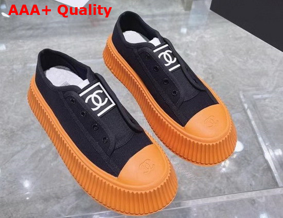 Chanel Sneaker in Black Canvas with Orange Rubber Sole Replica