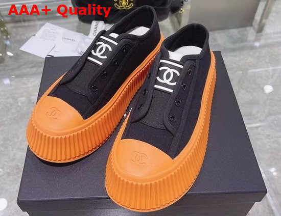 Chanel Sneaker in Black Canvas with Orange Rubber Sole Replica