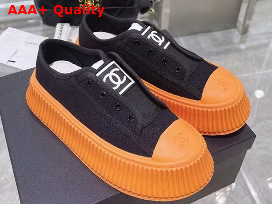 Chanel Sneaker in Black Canvas with Orange Rubber Sole Replica