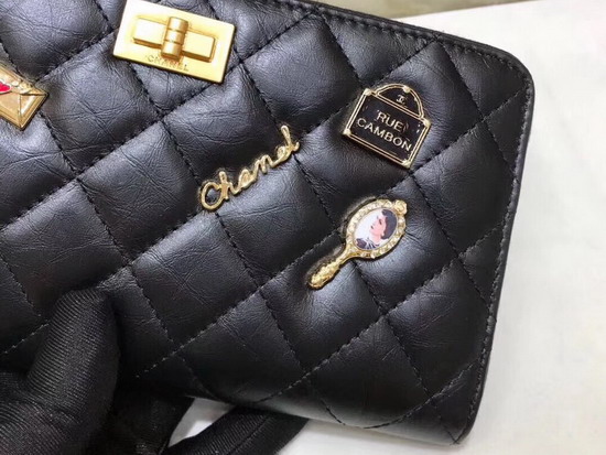 Chanel Zipped Wallet in Black Lambskin with Charms