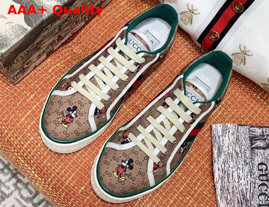 Gucci Womens Disney X Gucci Tennis 1977 Sneaker with Web Beige and Ebony Mini GG Canvas with Mickey Mouse Print 606110 Replica