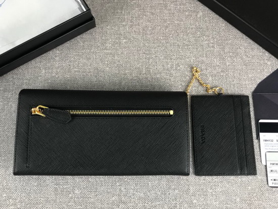 Prada Large Saffiano Leather Flap Wallet in Black with Metal Prada Lettering in the Same Tone