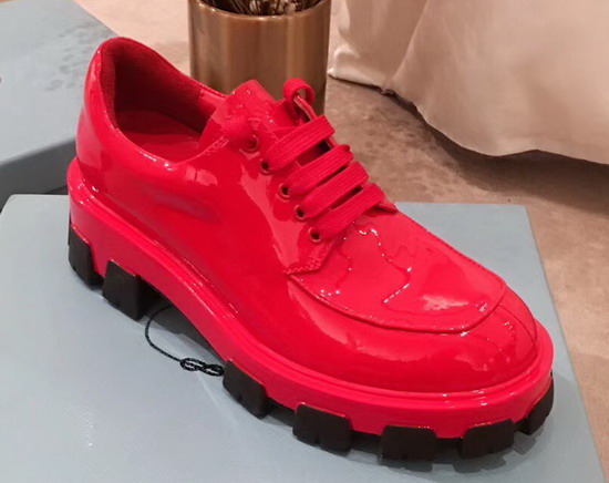 Prada Monolith Patent Leather Derby Shoes in Red