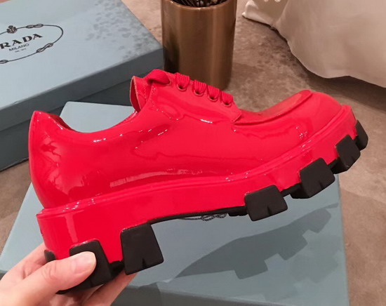 Prada Monolith Patent Leather Derby Shoes in Red