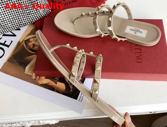 Valentino Garavani Rockstud Flat Rubber Sandal in Nude Replica